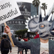 Illustration for article titled Hideo Kojima Teases What We Assume Is New ‘Death Stranding’ Info By Walking Around E3 Dressed As Triceratops And Waving A ‘Big, Brassy, And Beautiful’ Sign